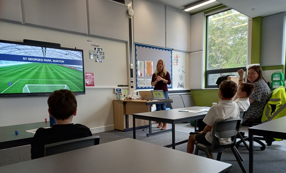 Helen talks to pupils