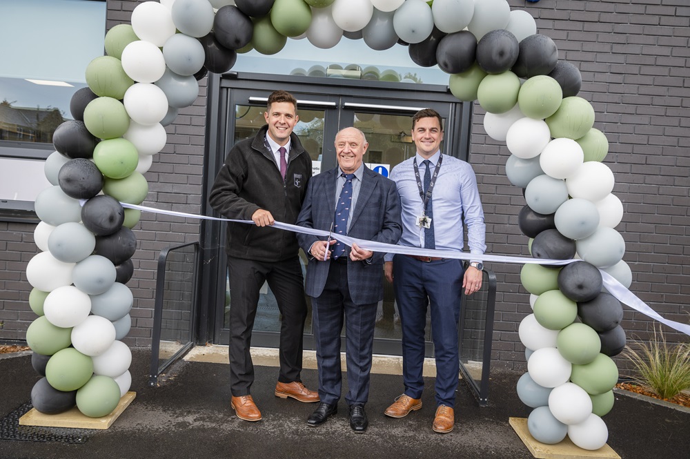 Ashley Caress, Executive Head, and James Ellis, CIT Director of SEND, stand with Tim Reddish CBE as he cuts the ribbon