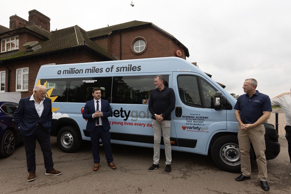 Mr Ellis makes a speech in front of the new minibus