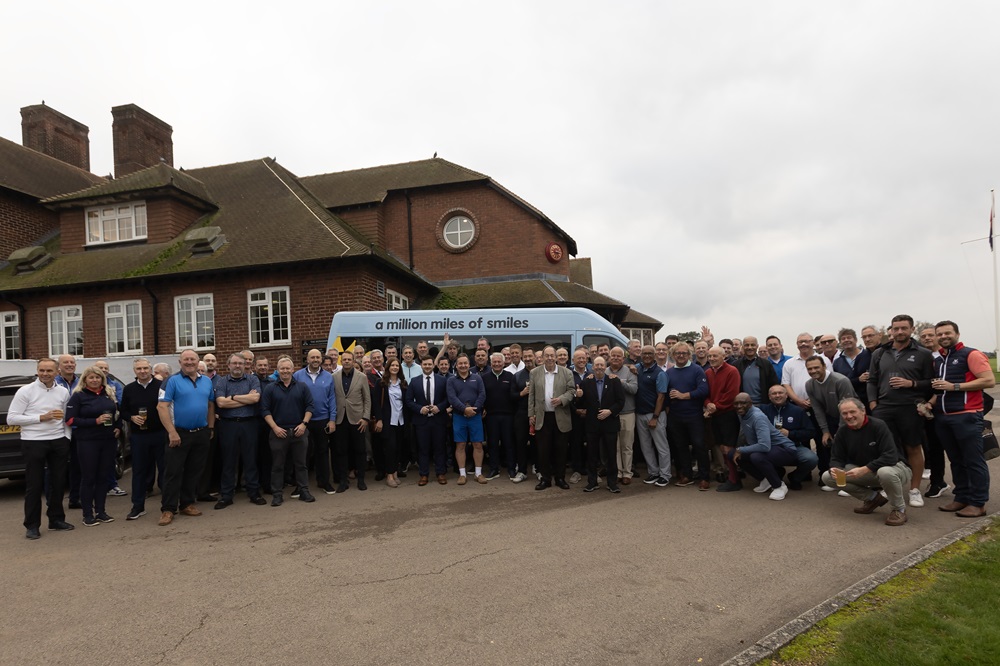 All sponsors gather around the bus