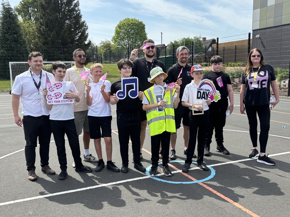Pupils and staff and Hits Radio all cheer for Cash for Kids