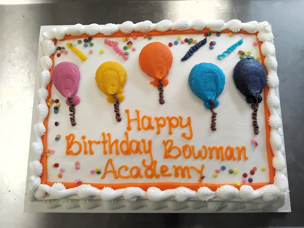 a birthday cake saying happy birthday bowman